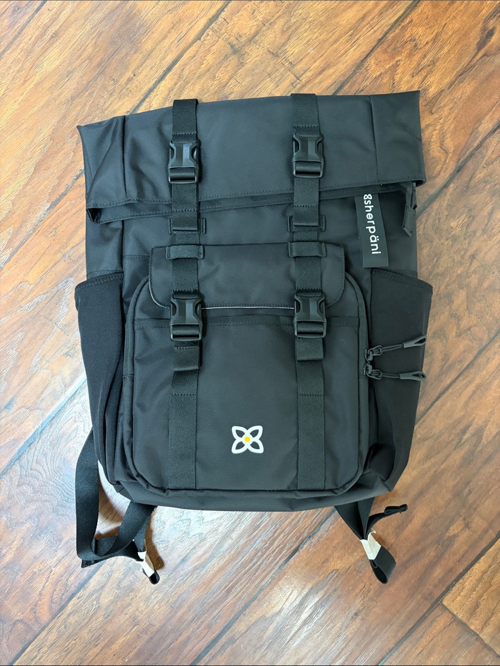Sherpani Black Fold-Top Sedona Backpack with Front Buckles. Water resistant